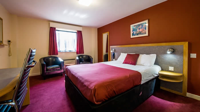 A bedroom at the Pendulum Hotel